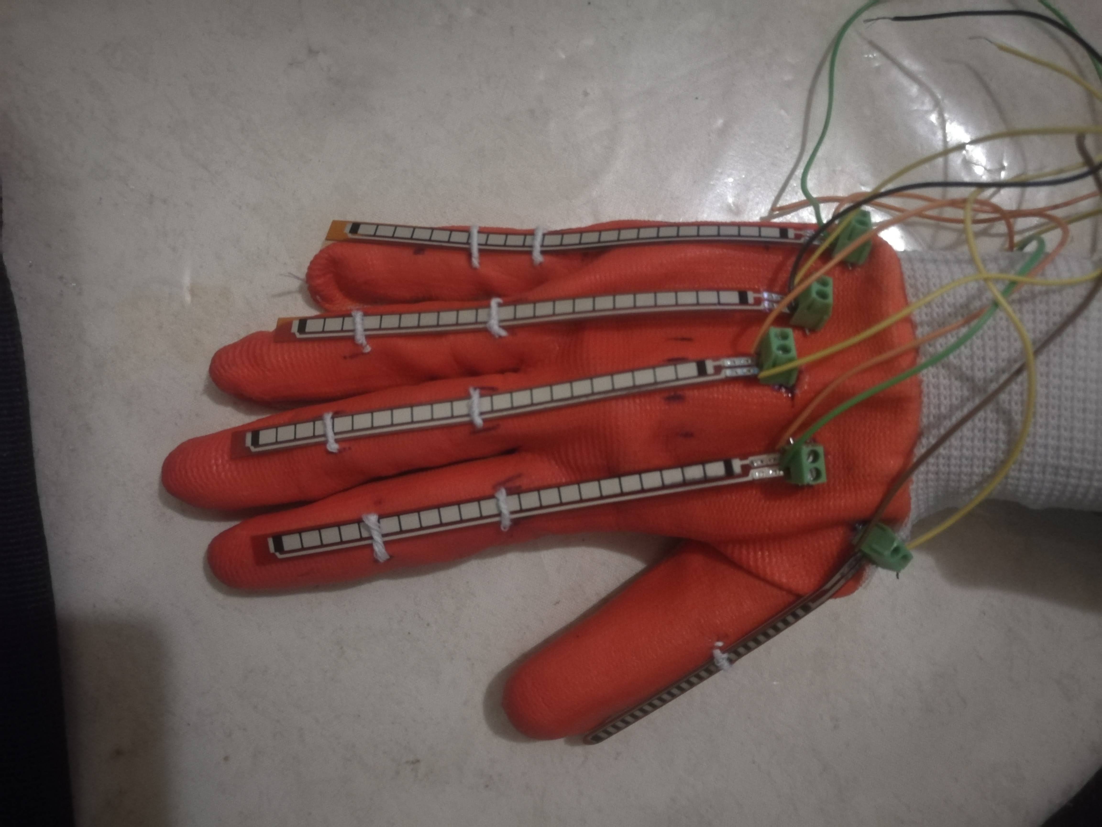 Glove attached with flex-sensors